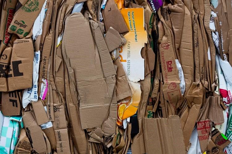 Crushed corrugated cardboard boxes ready to be recycled