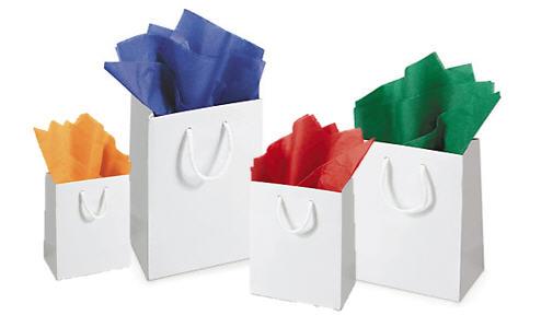 Add coloured tissue paper to gift bags